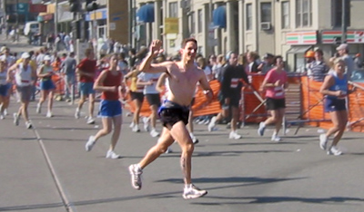 Owen Ozier running the 2003 Boston Marathon (photo by Lance
     Ozier, taken at Cleveland Circle)