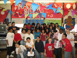 Locke school seventh grade students standing proud infront of their presentation on Nepal.