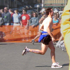 Owen Ozier running the 2003 Boston Marathon (photo by Lance
     Ozier, taken at Cleveland Circle)